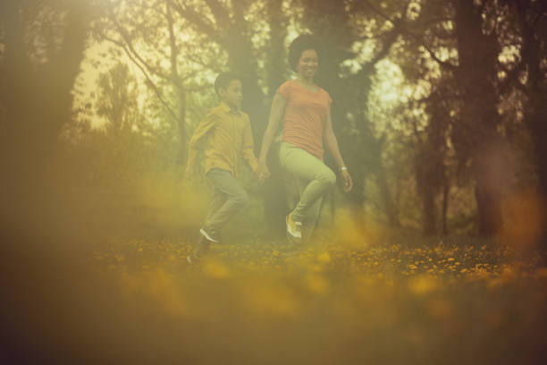 Enjoying this beautiful day in nature.  Mother and son in the park.