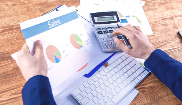 istock businessman calculator and tax 1144496236