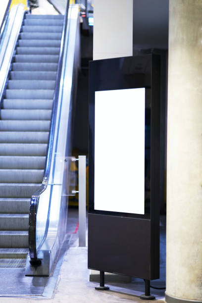 istock Mock up of light box beside escalator for advertising material 1144496329