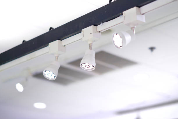 istock Spot light lamps installed on high bar 1144496861