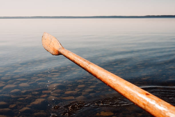 istock Oar rowing boat close up on a clear lake 1144497253