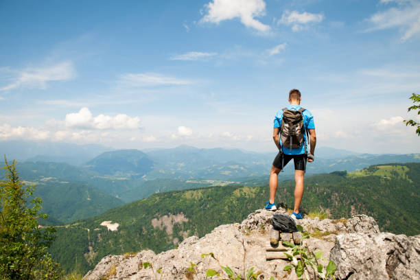istock Aczive young amn gesture success after climbing a mountain 1144497436