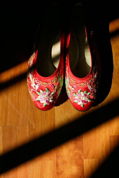 Red Chinese traditional wedding shoe on floor