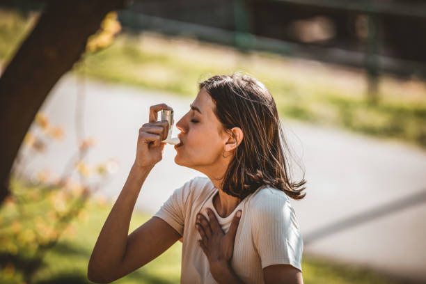 istock Woman Using Asthma Inhaler Outdoor 1144499012