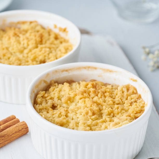 istock Close up apple crumble with streusel. Side view. Morning breakfast on light gray table. 1144502199