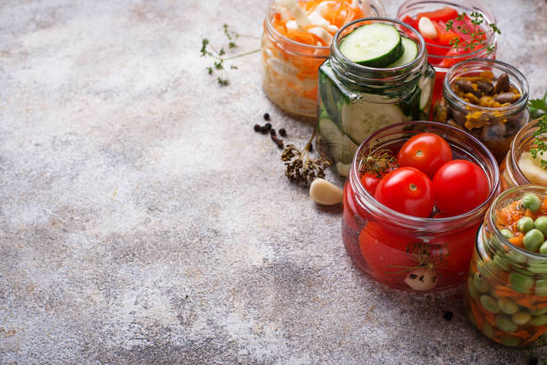 istock Fermented food. Preserved vegetables in jars 1144503113