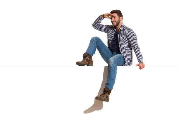 istock Happy Handsome Man Is Sitting On A Top And Watching 1144503304