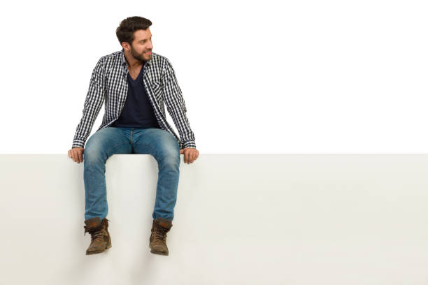 istock Handsome Man Is Sitting Relaxed On A Top And Looking Away 1144503317