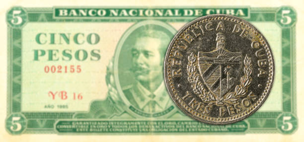 istock 3 cuban peso coin against 5 cuban peso banknote 1144504135