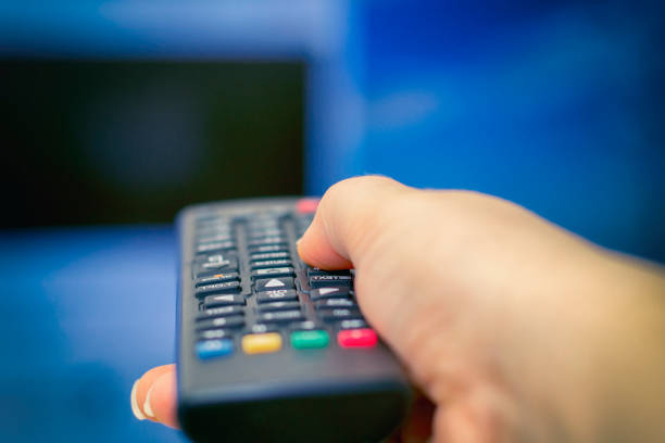 istock Remote control in hand. Smart tv. Tv remote control. 1144504569