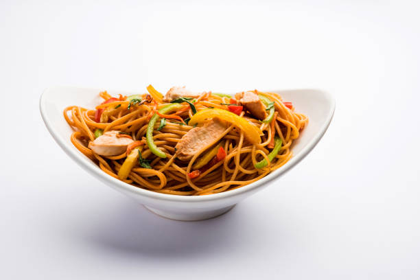istock Chicken Hakka/Schezwan noodles served in a bowl with chopsticks. selective focus 1144504786