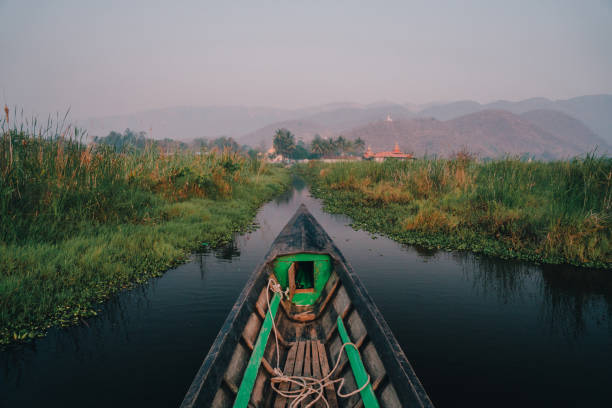 Scenic view of fishing boat on Inle lake at sunrise