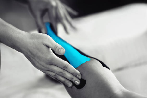 istock Achilles Tendon Treatment With Blue Kinesiology Tape 1144509374