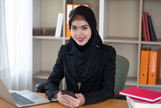 istock Smiling Young Businesswoman Wearing Hijab While Working In Office 1144510530