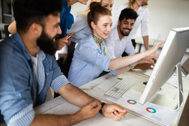 istock Successful business group of people at work in office 1144511218