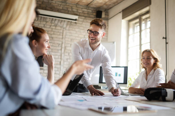 istock Happy creative team in office. Business, startup, design, people and teamwork concept 1144511456