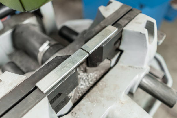 istock vise to secure the workpiece. Circular saw machine. Cutting a metal and steel with with sharp, circular blade in workshop interior. Tool store or exposition stand. 1144512472