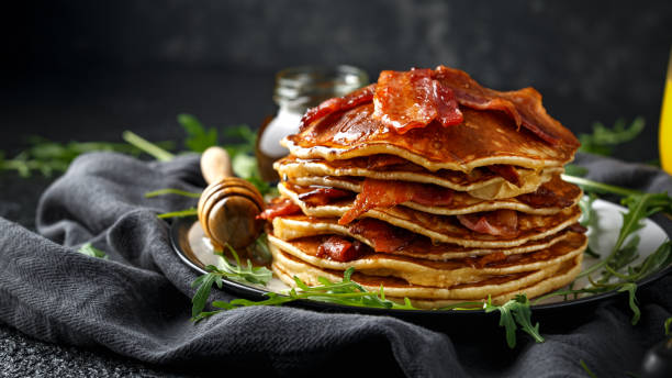 istock Pancakes with crispy bacon and maple syrup in a plate. Morning Breakfast 1144513154