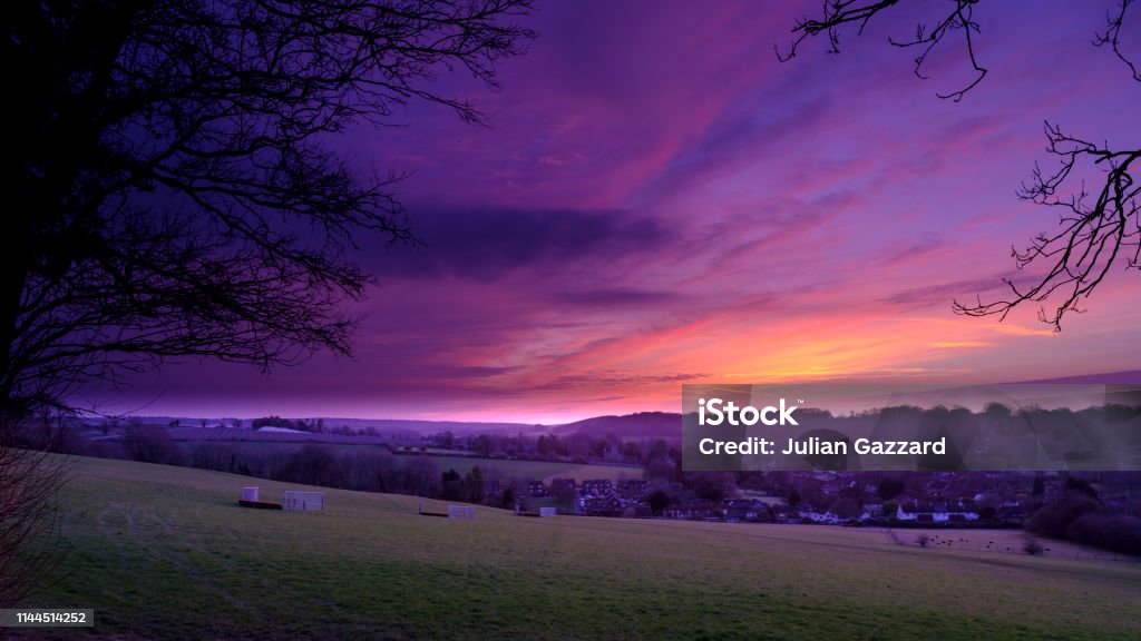 Spring sunrise over the village of Hambledon, Hampshire.  The village lies within the South Downs National Park, one of the UK's newest national parks created on 1 April 2011. Hambledon, UK - March 24, 2019: Spring sunrise over the village of Hambledon, Hampshire in the South Downs National Park, UK England Stock Photo