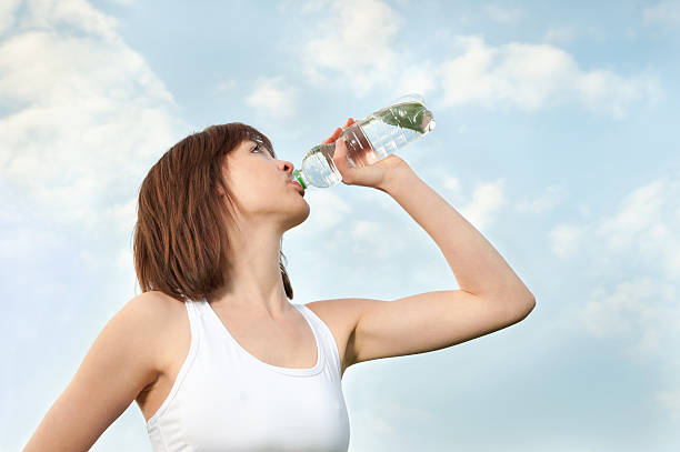 istock Young athletic woman drinking mineral water 114451445