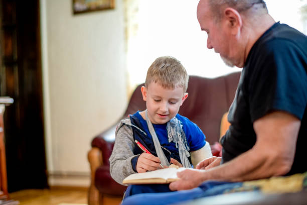 istock Grandfather helping grandson 1144514909