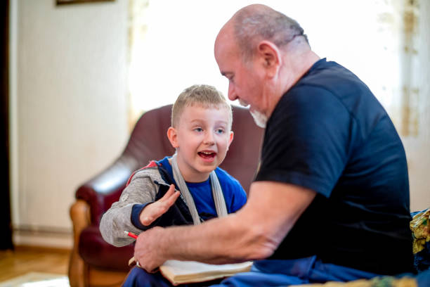 istock Grandfather helping grandson 1144515277