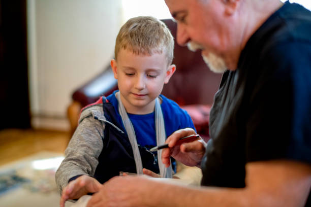 istock Grandfather helping grandson 1144516128