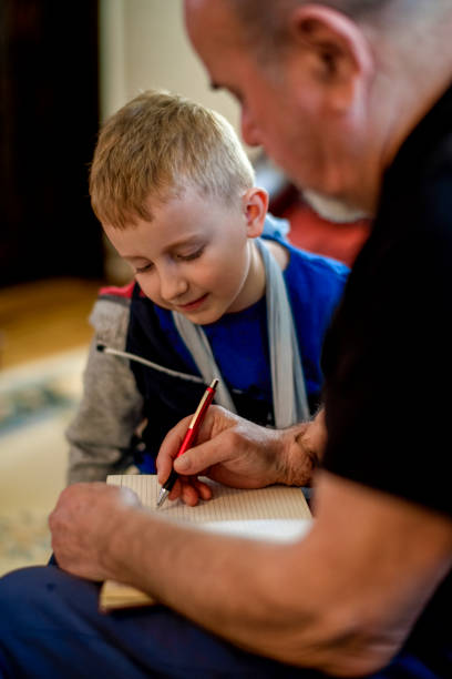 Grandfather drawing with his grandson