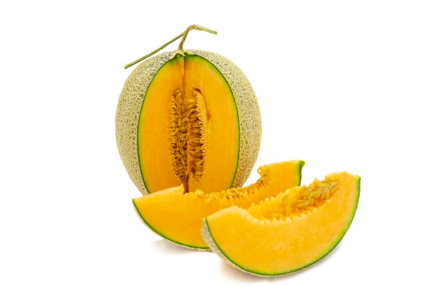 istock Closeup melon bright colors that is turned and pieces isolated on white background. 1144516490