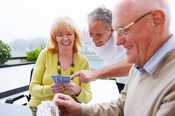 istock Elderly Couple Playing Cards 114451783