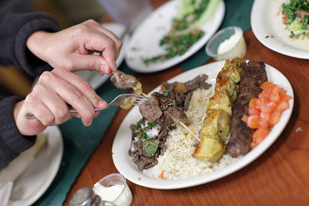 istock Man takes piece of kebab 114451834