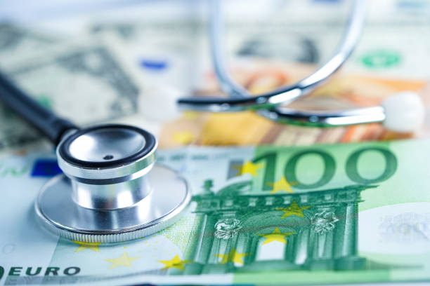 istock Stethoscope on Euro banknotes, Finance, Account, Statistics, Analytic research data and Business company  medical health meeting concept 1144518390