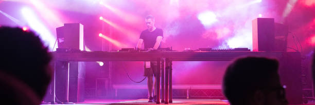 istock Dj playing techno music in the nightclub 1144518958