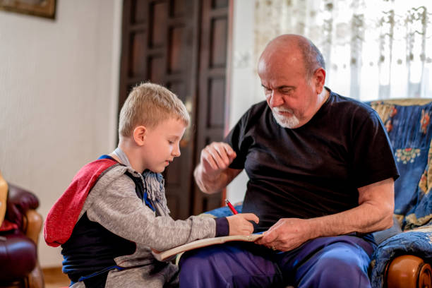 istock Grandfather helping grandson 1144520120