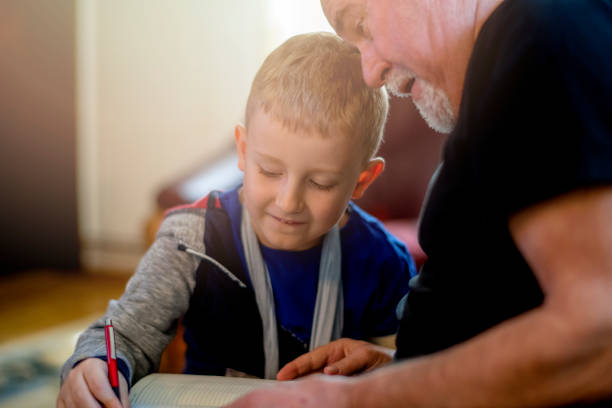 istock Grandfather helping grandson 1144520424