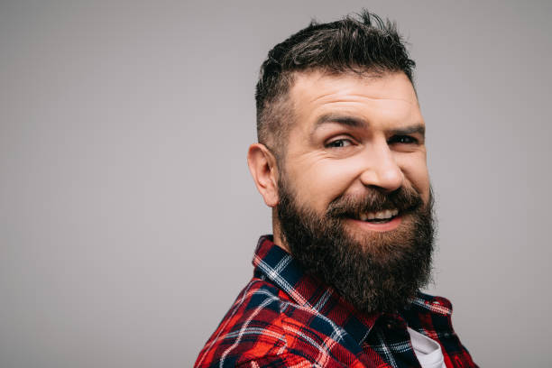 istock happy bearded man in checkered shirt isolated on grey 1144521012