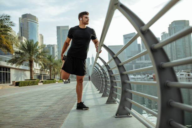 istock Stretching those muscles before hitting the city streets 1144521975