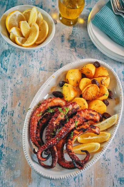 istock Octopus Tentacles with Potatoes and Fresh Lemon 1144523143