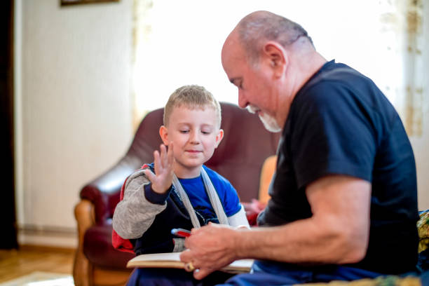 istock Grandfather helping grandson 1144523779
