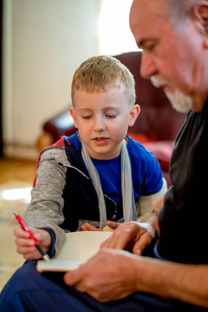 istock Grandfather drawing with his grandson 1144524637