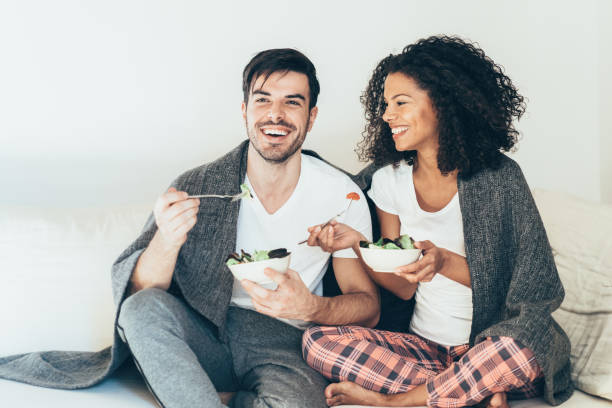 istock Couple in love eating salad 1144524726