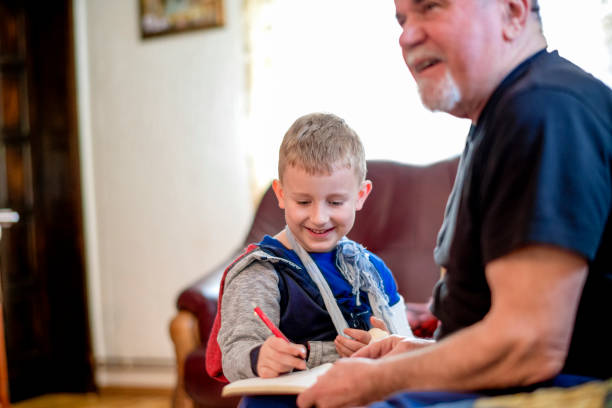 istock Little boy with his grandfather 1144524840