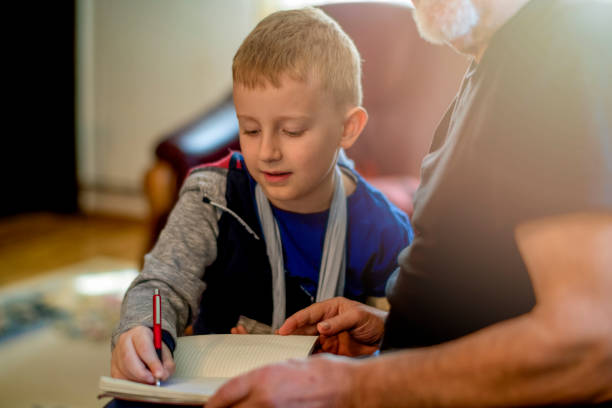 istock Grandfather helping grandson 1144525127