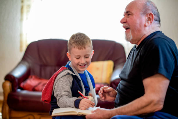istock Grandfather helping grandson 1144525279