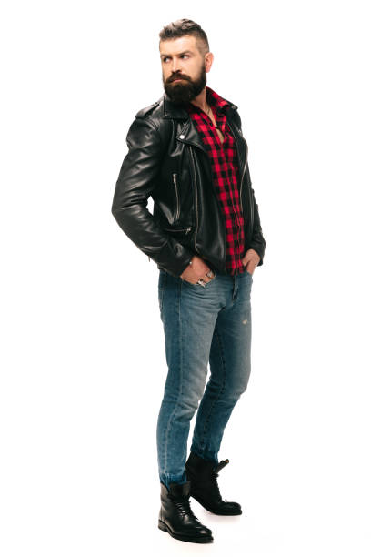 istock bearded man posing in black leather jacket isolated on white 1144525308