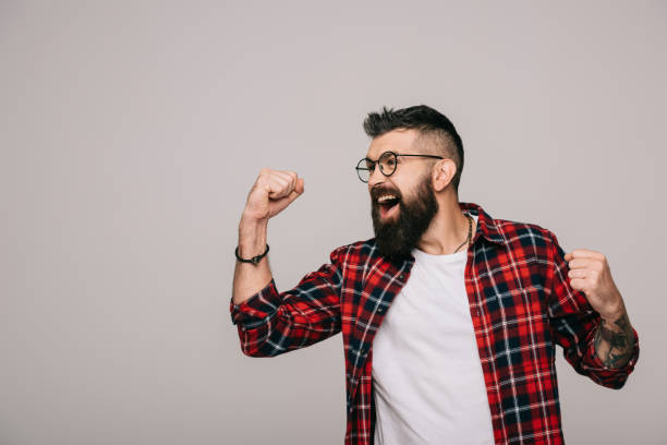 istock excited bearded man in checkered shirt, isolated on grey 1144525398