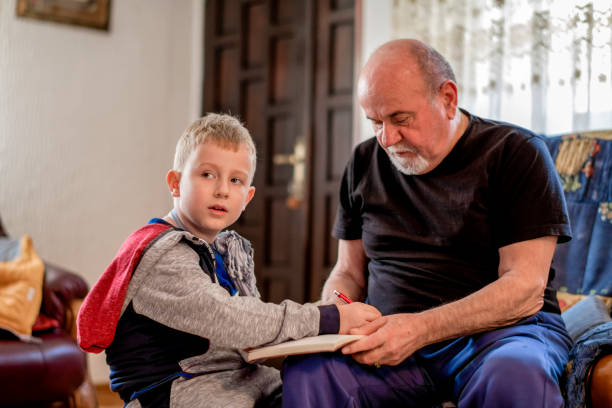 istock Grandfather drawing with his grandson 1144525765