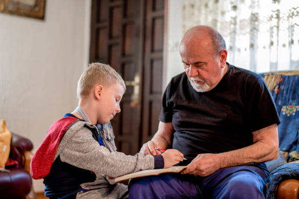 istock Little boy with his grandfather 1144527250
