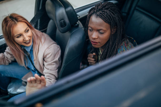 istock Beautiful women riding in car 1144527830