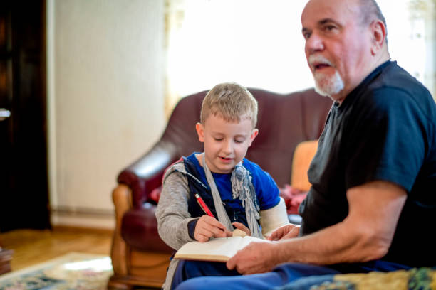 istock Grandfather helping grandson 1144528193